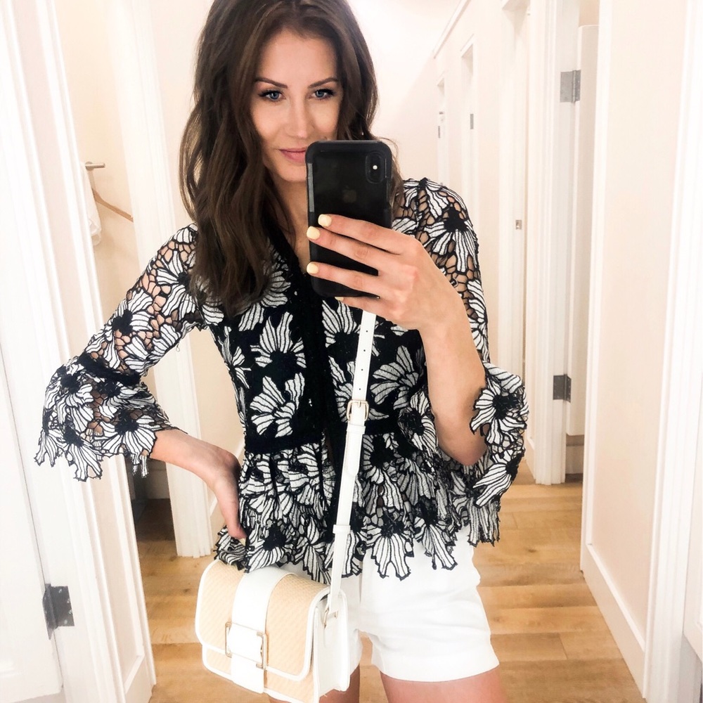 Embroidered floral crochet peplum top.
